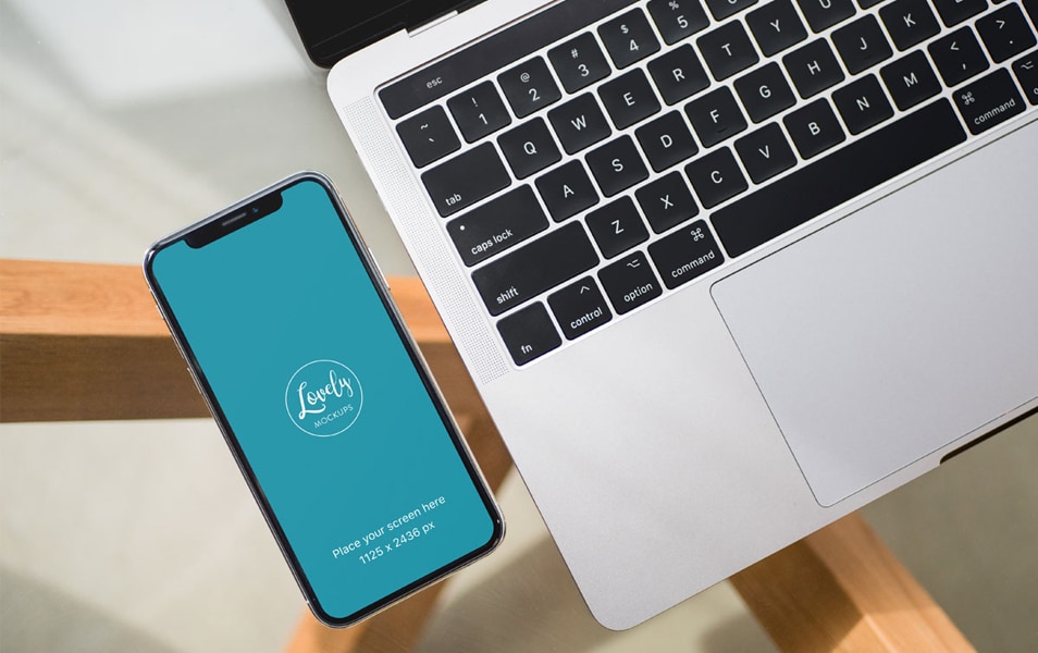 iPhone X and Macbook on Glass Table